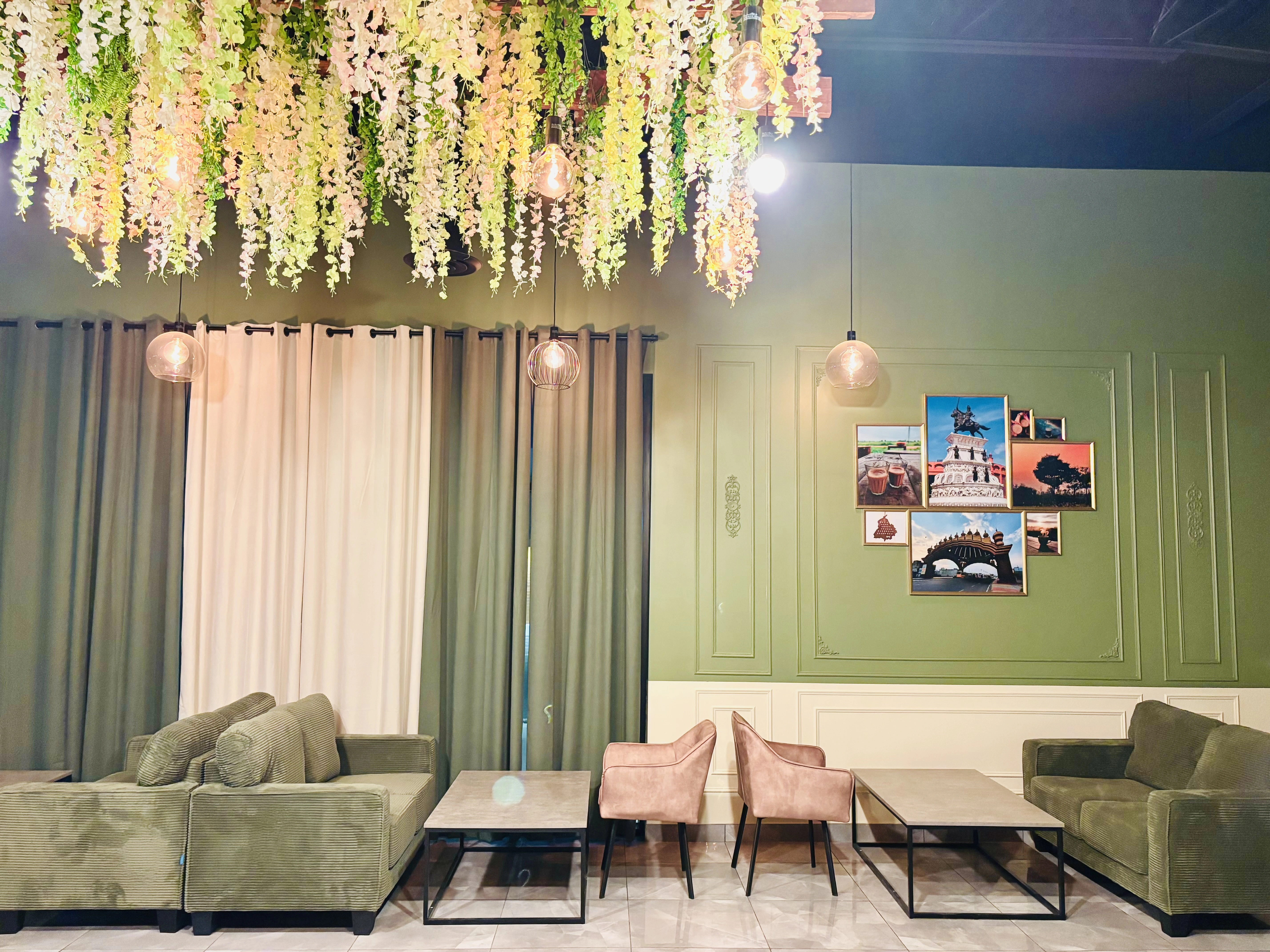 Lounge seating under the floral ceiling canopy at Chai on 34, Charlesworth Edmonton