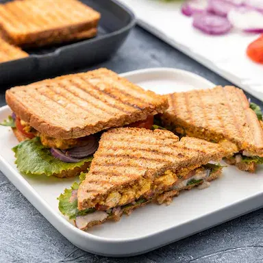 Achari grilled sandwich served hot at Chai on 34, Edmonton