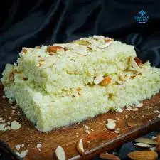 Milk cake rasmalai dessert topped with almonds and pistachio at Chai on 34, Edmonton